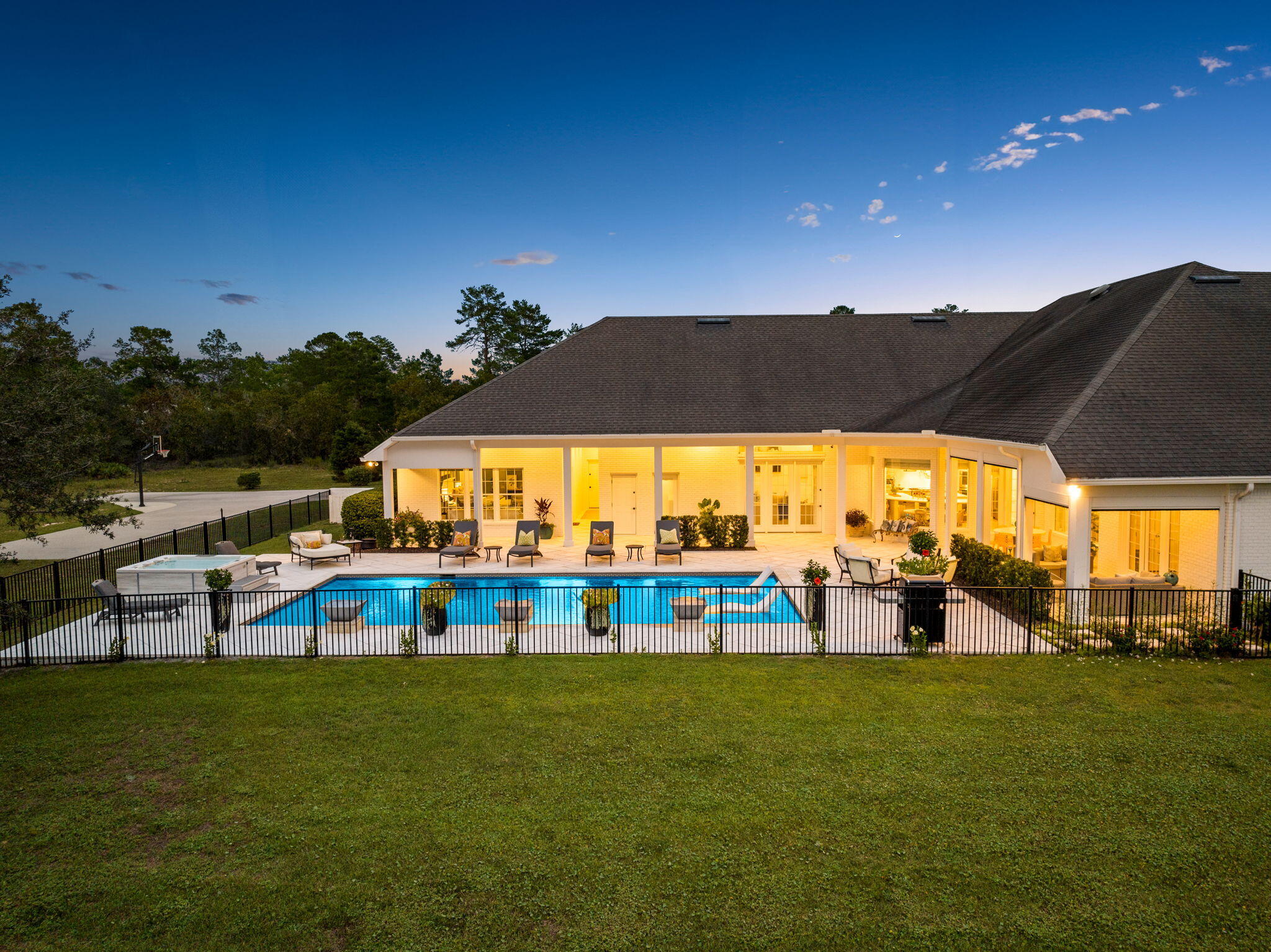 486 Coastal Breeze Drive Freeport, FL 32439 - Photo 55 of 70 a view of a swimming pool with a table and chairs