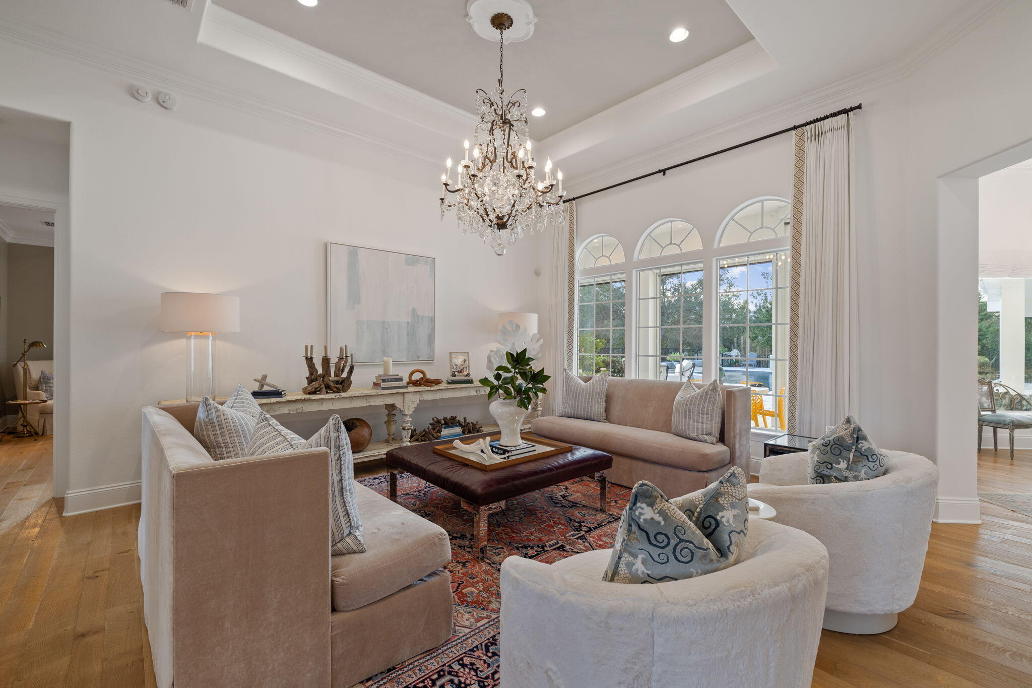 486 Coastal Breeze Drive Freeport, FL 32439 - Photo 6 of 70 a living room with fireplace furniture and a chandelier