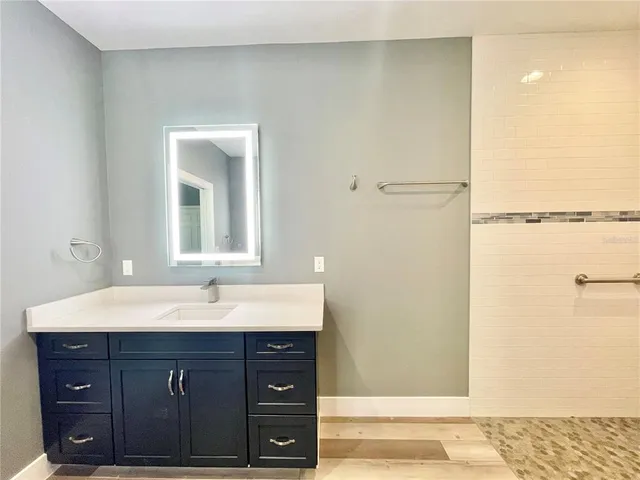 a bathroom with a bathtub and a shower