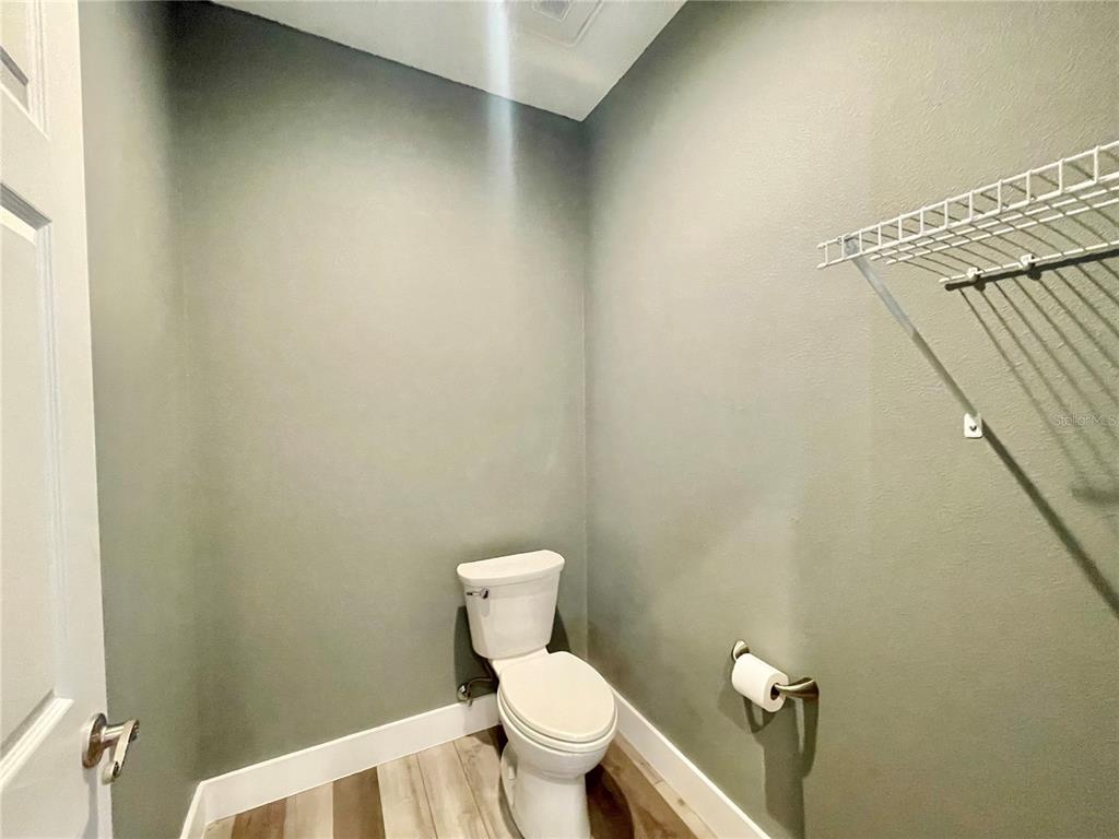 10620 Southwest 10th Terrace Micanopy, FL 32667 - Photo 20 of 58 a white toilet sitting next to a small bathroom