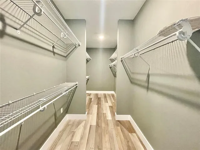 a bathroom with a sink a mirror and a shower