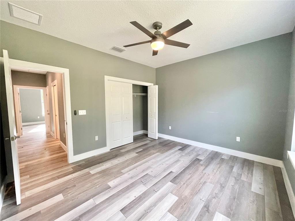 10620 Southwest 10th Terrace Micanopy, FL 32667 - Photo 23 of 58 a view of a livingroom with a ceiling fan