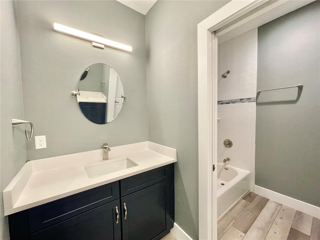 10620 Southwest 10th Terrace Micanopy, FL 32667 - Photo 26 of 58 a en suite bathroom with a sink and a mirror