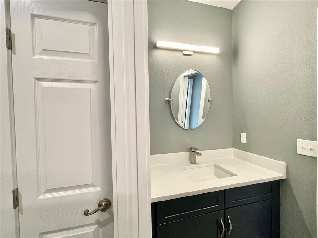 10620 Southwest 10th Terrace Micanopy, FL 32667 - Photo 27 of 58 a bathroom with a sink and a mirror