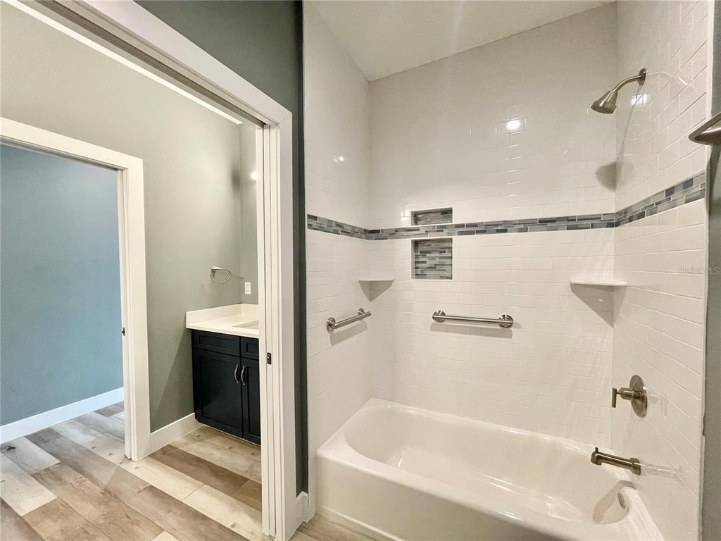 10620 Southwest 10th Terrace Micanopy, FL 32667 - Photo 28 of 58 a bathroom with a bathtub and a shower