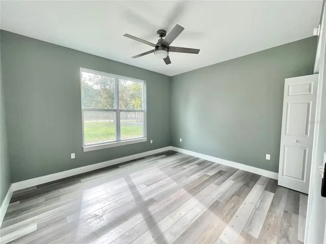 a view of a closet area with an empty room