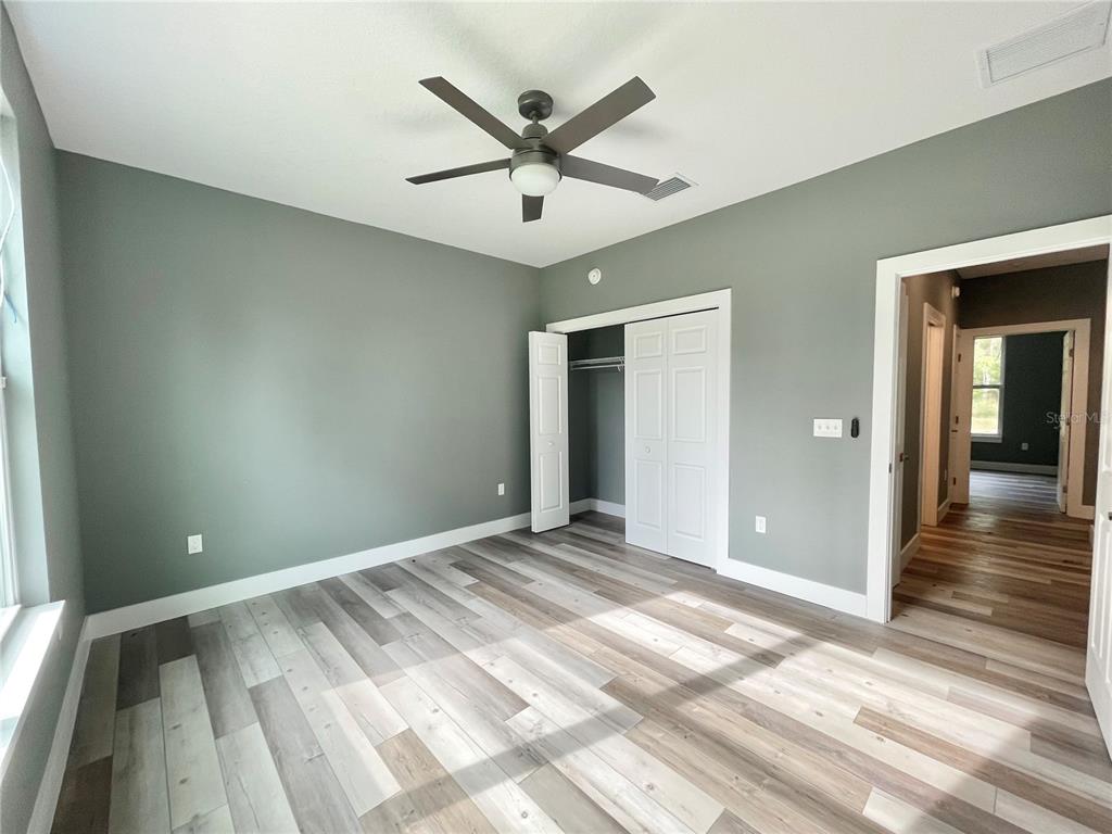 10620 Southwest 10th Terrace Micanopy, FL 32667 - Photo 31 of 58 a view of an empty room and wooden floor