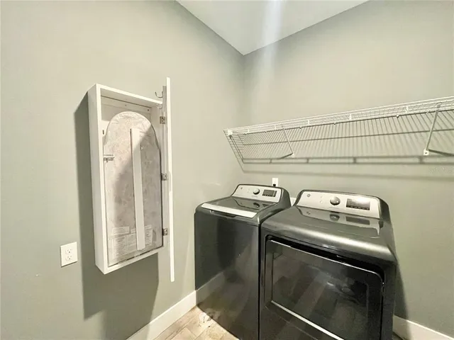 wooden floor and a bathroom with a sink