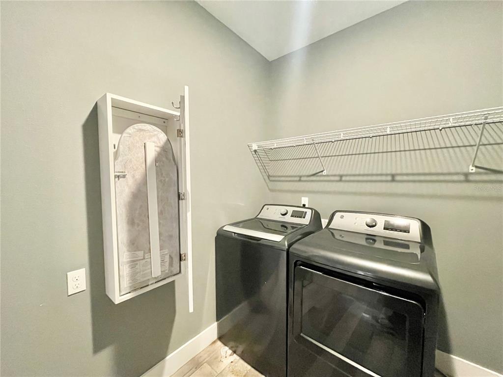 10620 Southwest 10th Terrace Micanopy, FL 32667 - Photo 37 of 58 a utility room with dryer and washer