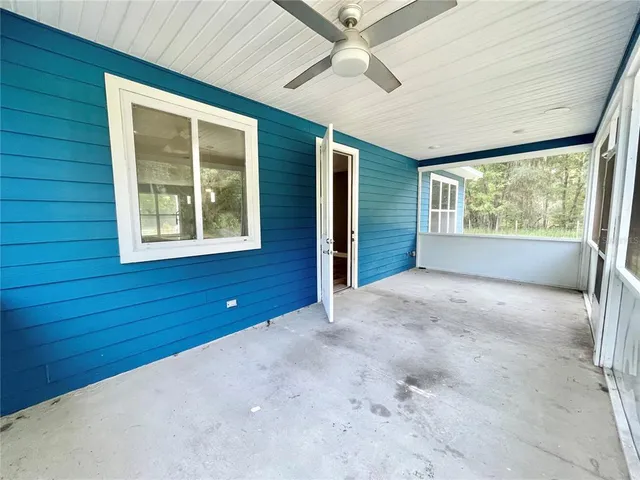 a bedroom with a bed and chandelier