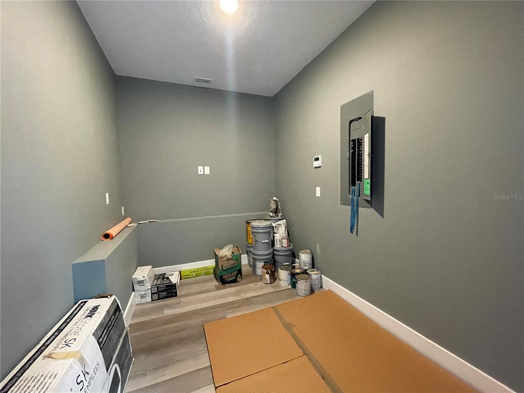 10620 Southwest 10th Terrace Micanopy, FL 32667 - Photo 44 of 58 a bedroom with a bed and chandelier