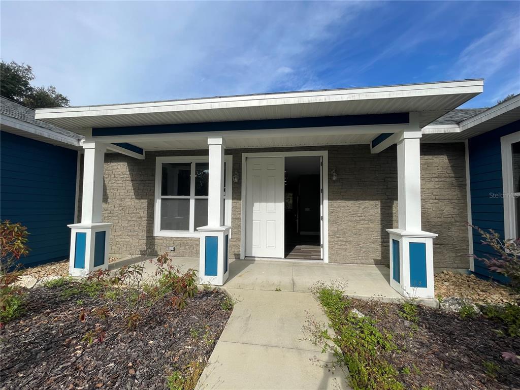 10620 Southwest 10th Terrace Micanopy, FL 32667 - Photo 49 of 58 a front view of a house with garden