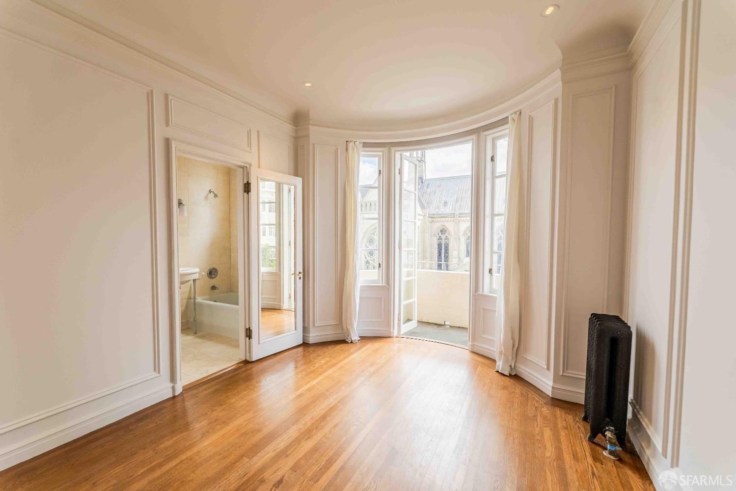 1298 Sacramento Street, Unit 6 San Francisco, CA 94108 - Photo 6 of 7 a view of a livingroom with wooden floor and a window