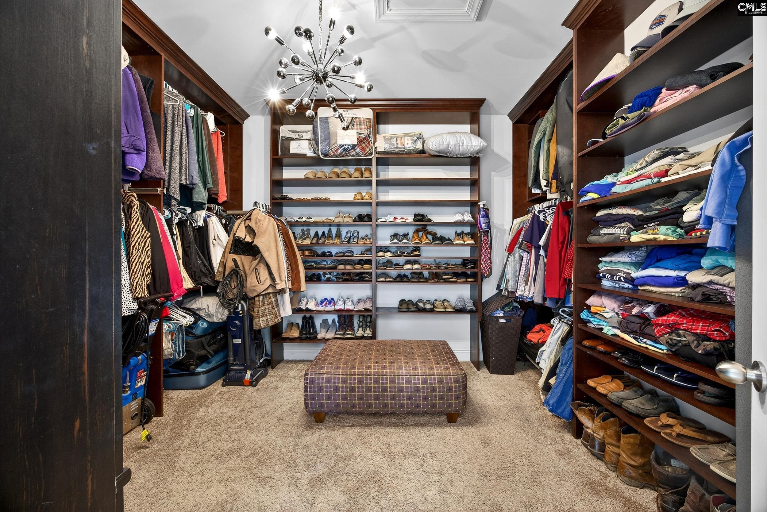 116 Renard Way Gilbert, SC 29054 - Photo 41 of 74 a view of walk in closet with clothes and shoes