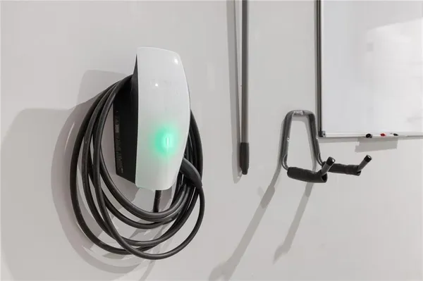 an aerial view of a residential house with pool