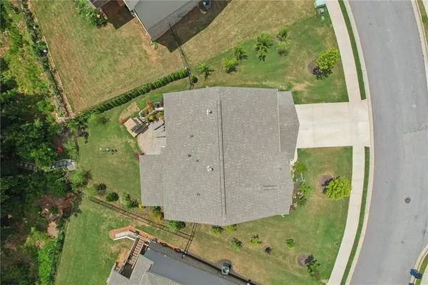 a balcony with furniture and a potted plant