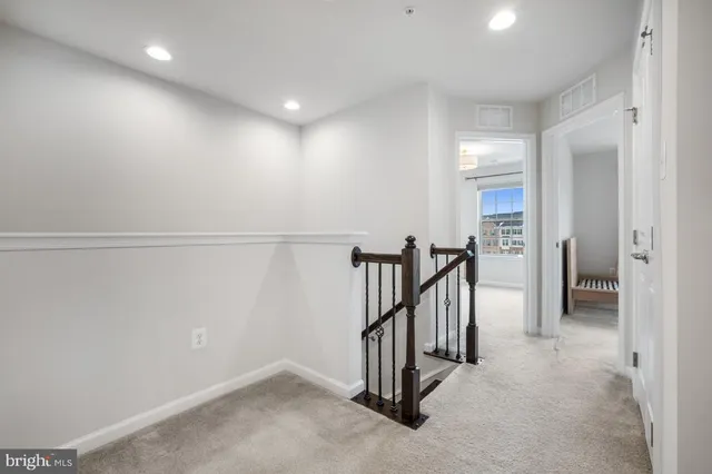 a view of a hallway with staircase