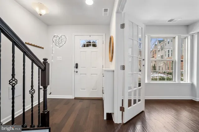 a view of front door with white walls and white walls