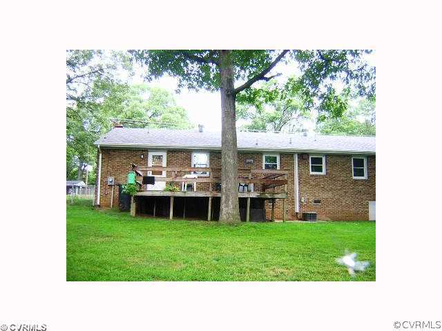 2309 Coxendale Road Chester, VA 23831 - Photo 5 of 12 a front view of a house with a yard table and chairs