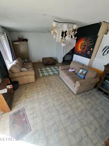 a living room with furniture and flat screen tv