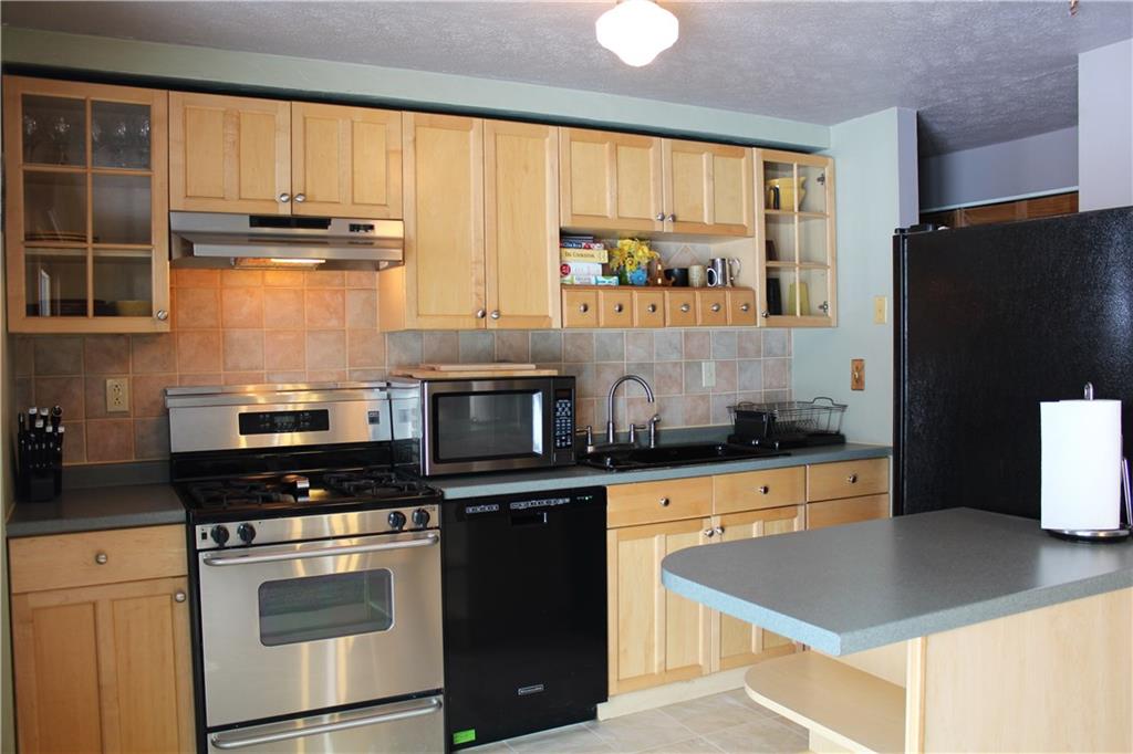 301 Partridge Run Road Gibsonia, PA 15044 - Photo 6 of 25 Kitchen opens directly into dining room.