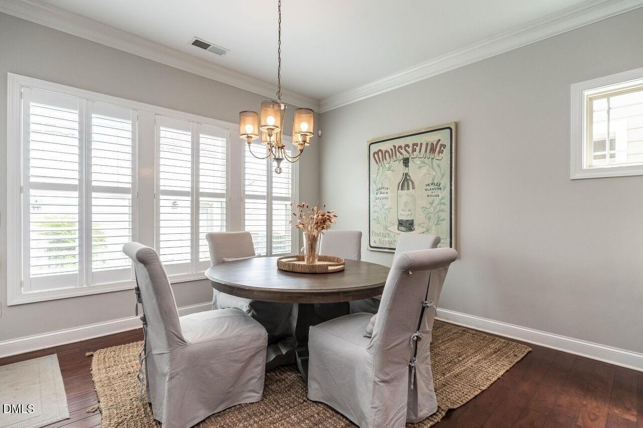 1572 Rodessa Run Raleigh, NC 27607 - Photo 17 of 39 a dining room with furniture and window