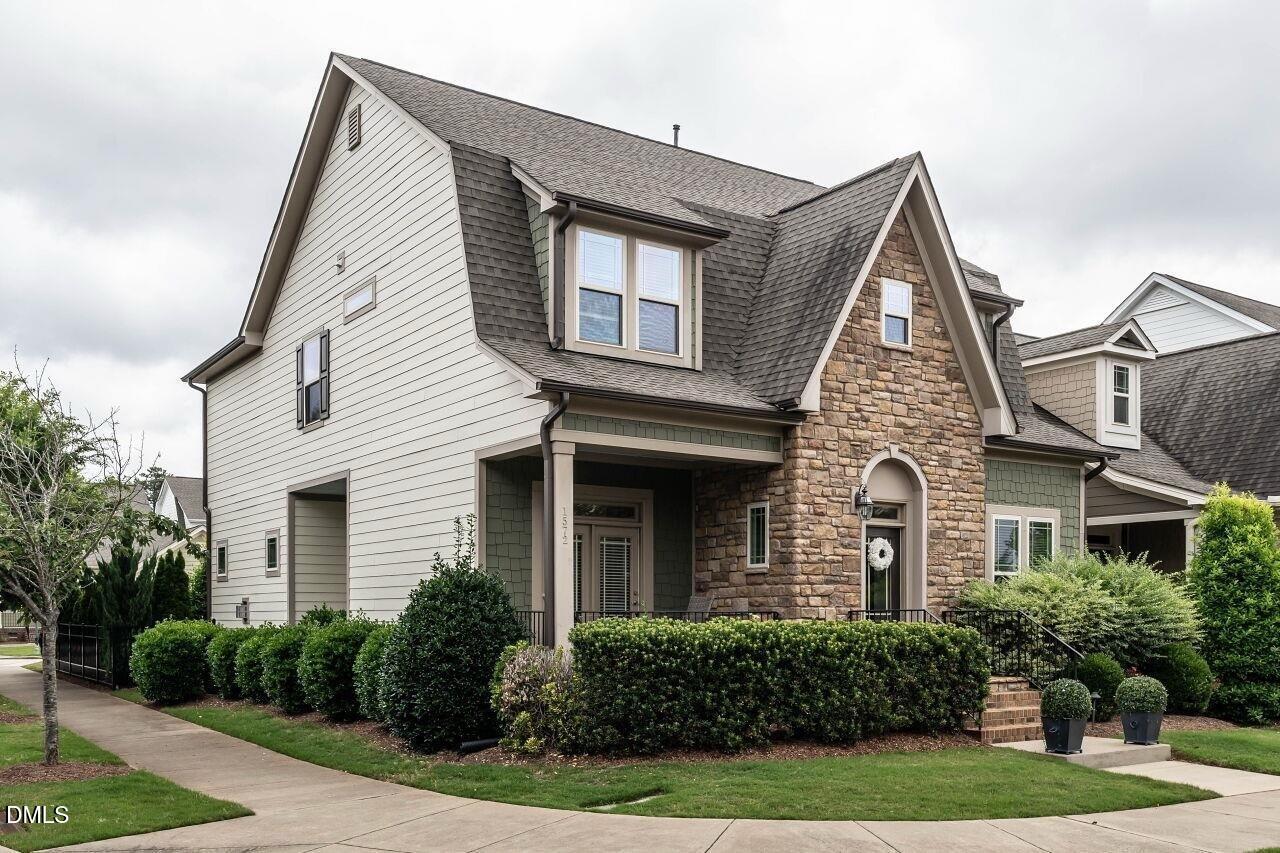 1572 Rodessa Run Raleigh, NC 27607 - Photo 2 of 39 a front view of a house with garden