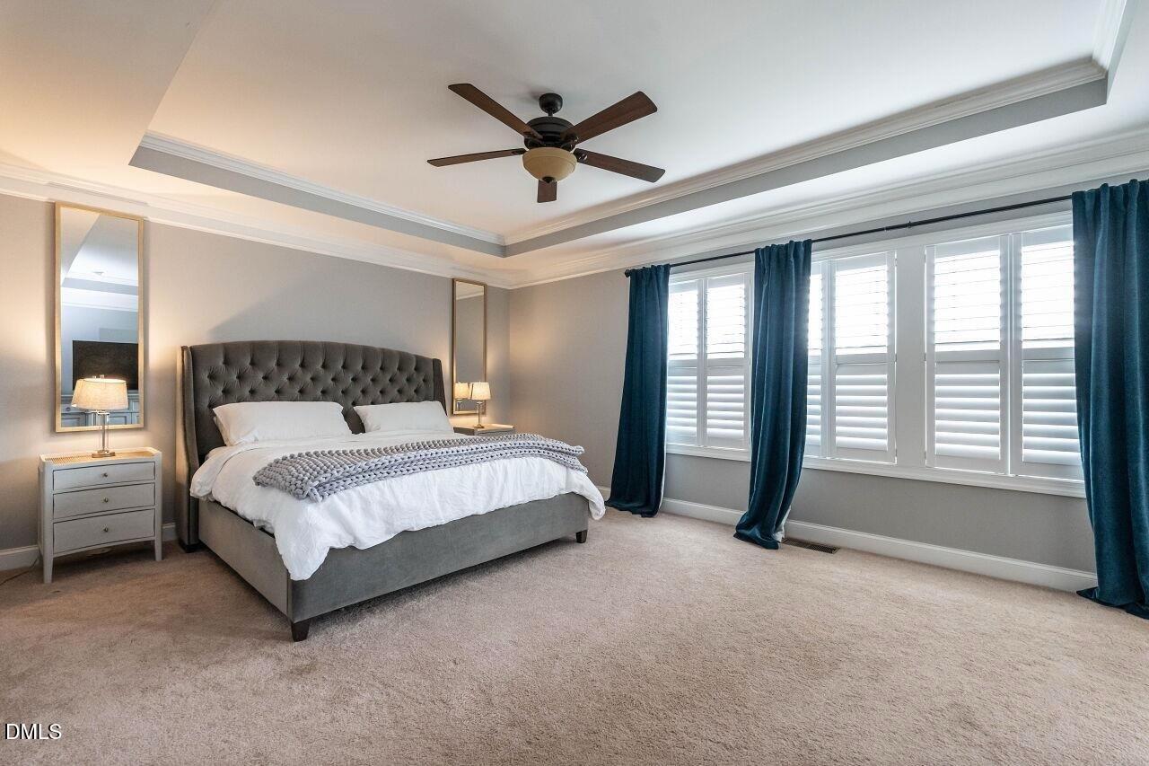 1572 Rodessa Run Raleigh, NC 27607 - Photo 21 of 39 a bedroom with a bed and a large window