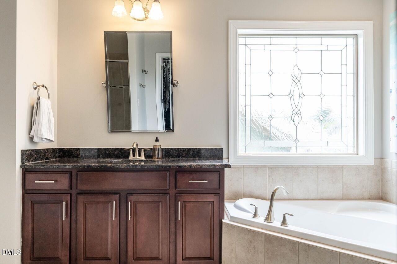 1572 Rodessa Run Raleigh, NC 27607 - Photo 24 of 39 a bathroom with a sink and a bathtub