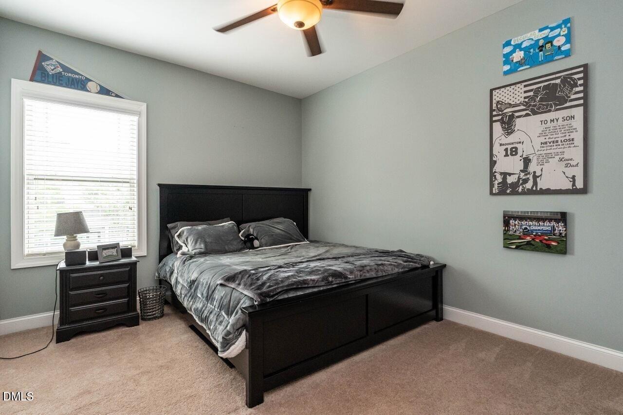 1572 Rodessa Run Raleigh, NC 27607 - Photo 29 of 39 a bed sitting in a bedroom next to a window