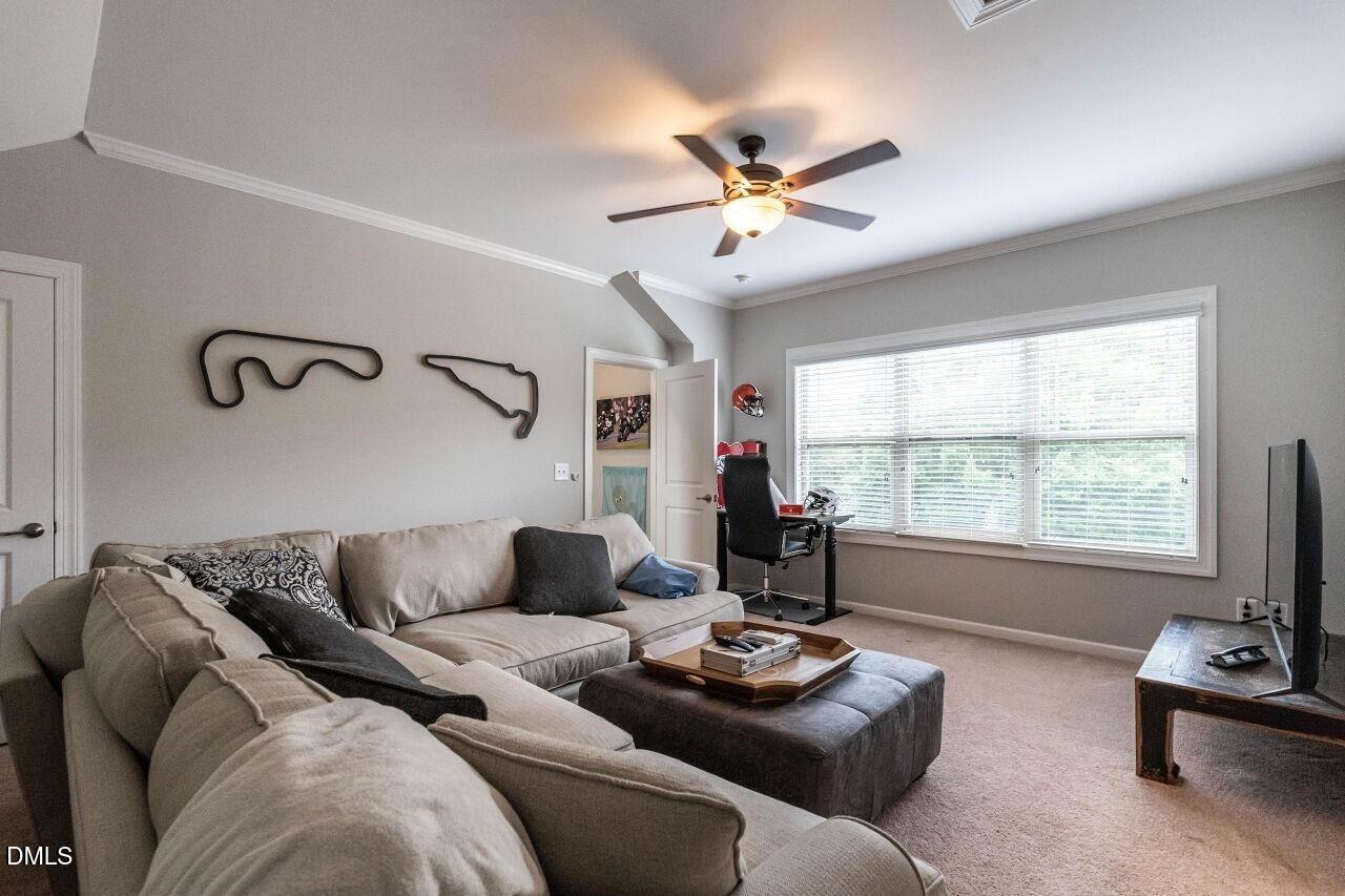 1572 Rodessa Run Raleigh, NC 27607 - Photo 35 of 39 a living room with furniture and a large window