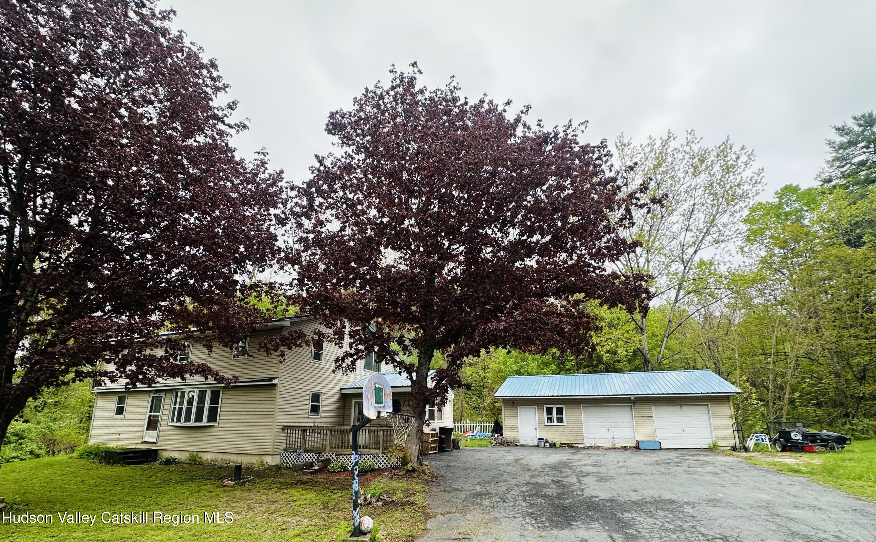 1640 Co Rte 13 Brainard, NY 12024 - Photo 1 of 23 a view of a white house with a big yard and large tree