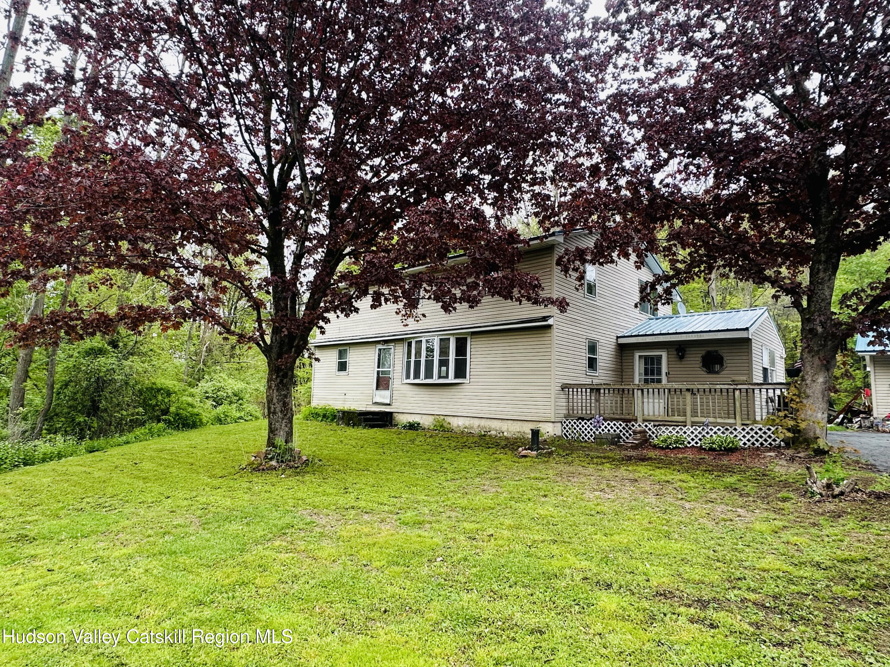 1640 Co Rte 13 Brainard, NY 12024 - Photo 2 of 23 a house that has a tree in front of a house