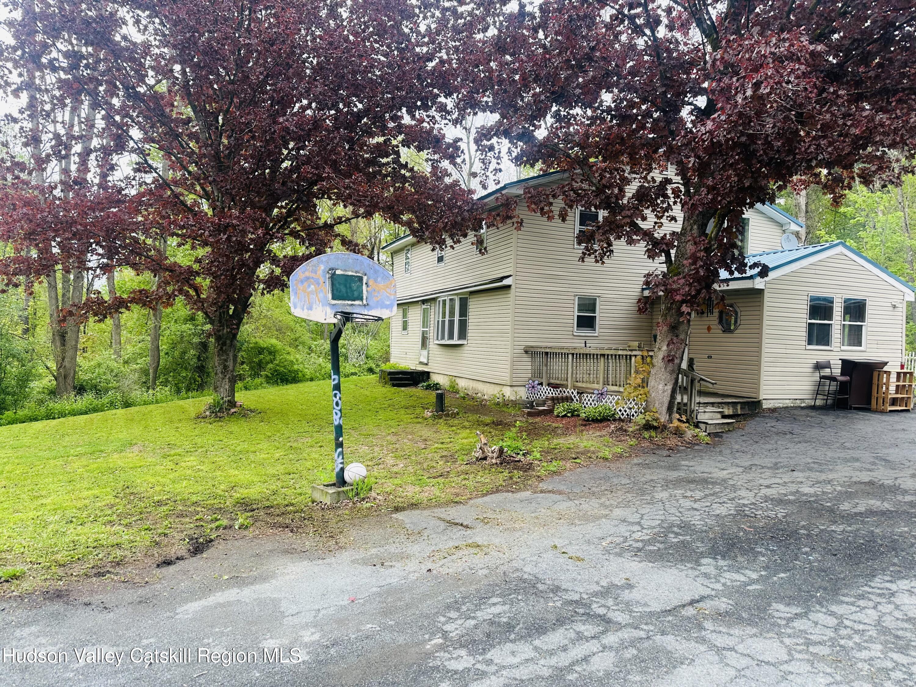 1640 Co Rte 13 Brainard, NY 12024 - Photo 3 of 23 a front view of a house with garden