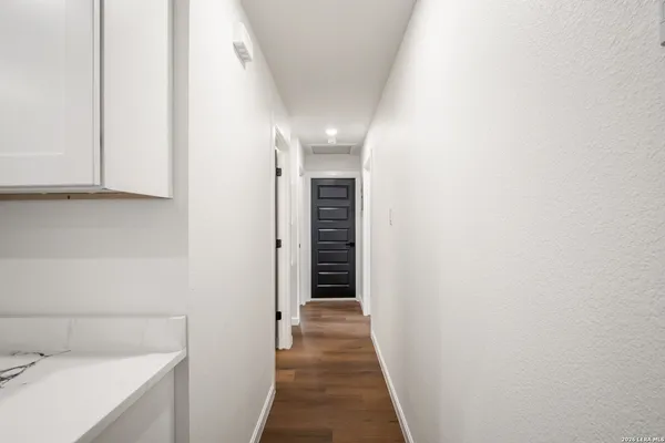 a view of a hallway with an entryway