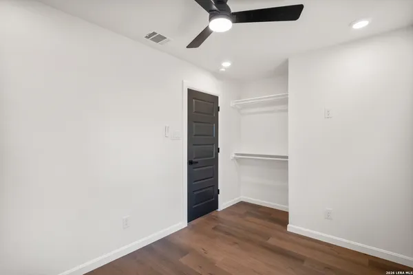 a view of an empty walk in closet