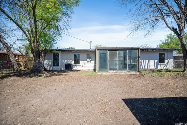 a house with trees in front of it