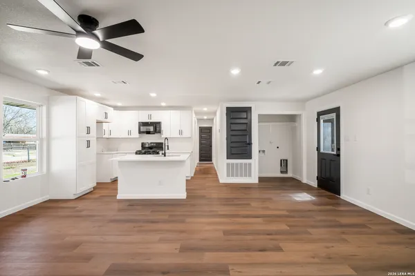 a view of kitchen with stainless steel appliances refrigerator oven and stove