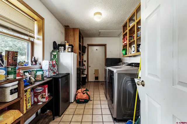 a room with furniture a washer and dryer