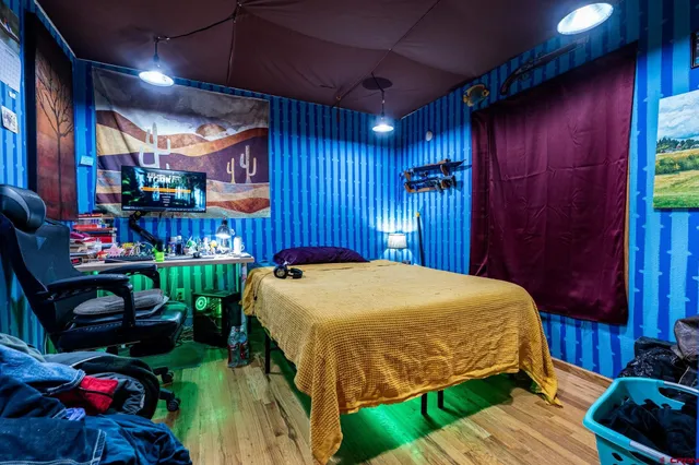 a bed sitting in a room next to a building