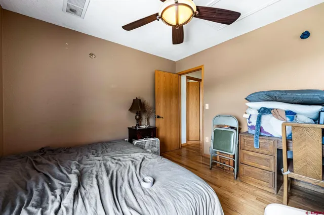 a bedroom with a bed and a table