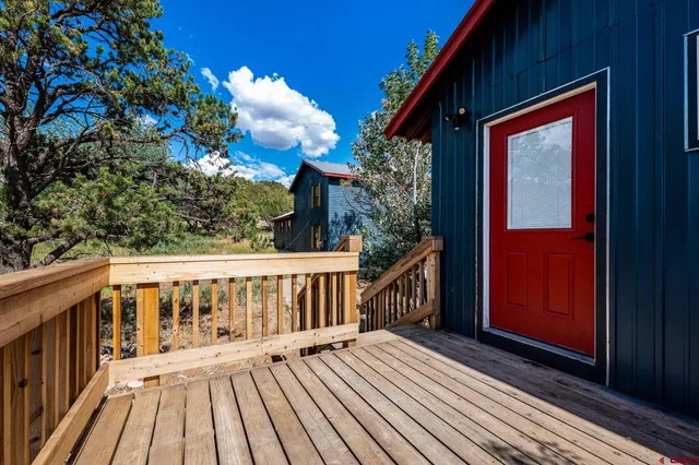 a view of balcony with wooden floor