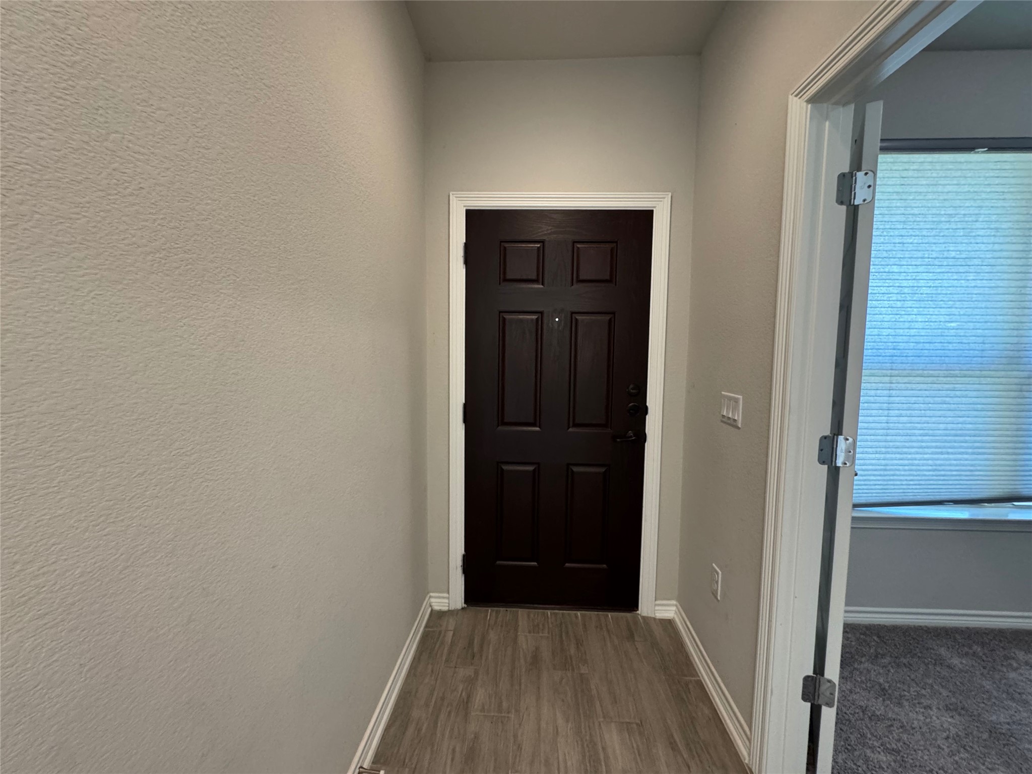 14100 McCoy Loop, Unit 1 Austin, TX 78717 - Photo 2 of 39 A welcoming entryway with durable flooring greets visitors to this residence.
