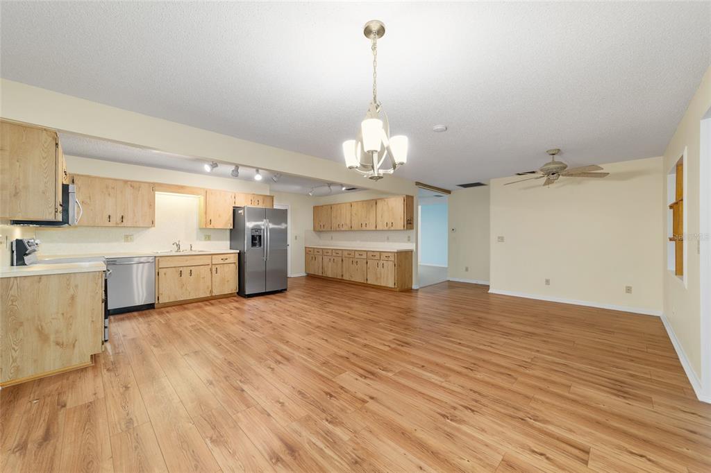 8890 Southwest 96th Street, Unit B Ocala, FL 34481 - Photo 14 of 42 a view of a kitchen with a sink cabinets and wooden floor