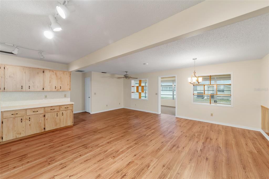 8890 Southwest 96th Street, Unit B Ocala, FL 34481 - Photo 18 of 42 a view of a kitchen with wooden floor and window