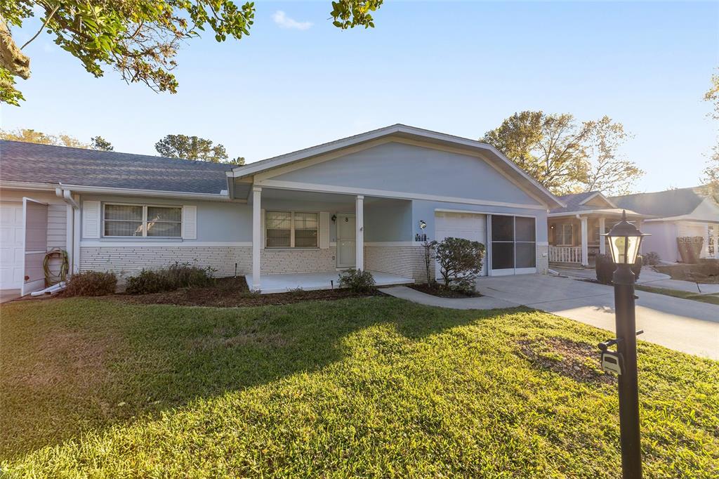 8890 Southwest 96th Street, Unit B Ocala, FL 34481 - Photo 2 of 42 a view of a house with backyard and porch
