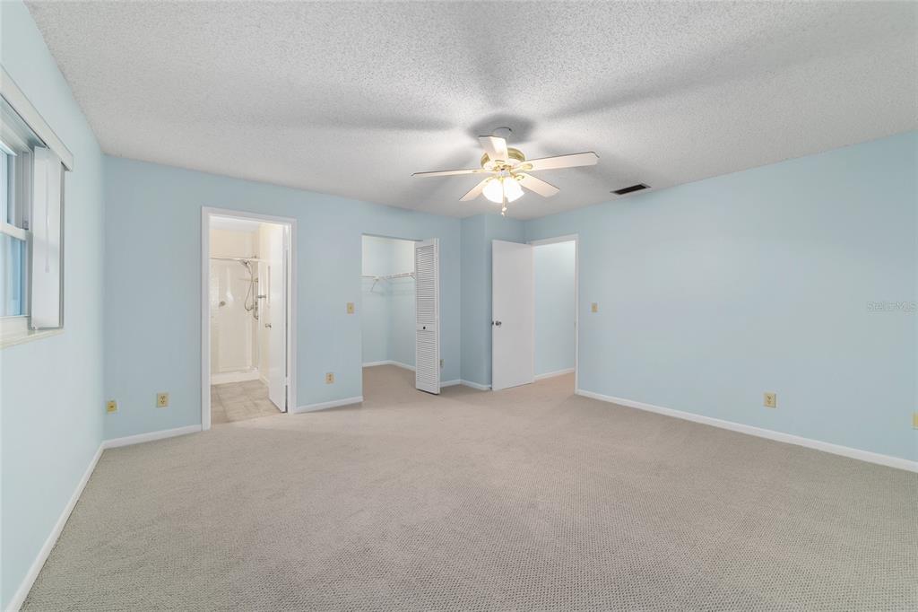 8890 Southwest 96th Street, Unit B Ocala, FL 34481 - Photo 23 of 42 an empty room with chandelier fan