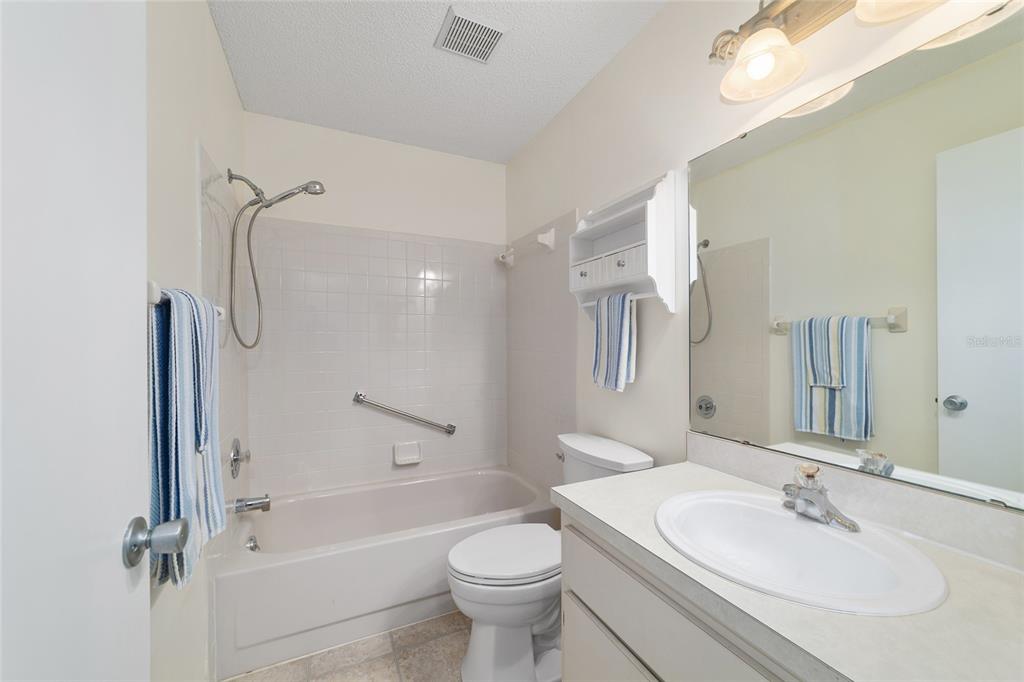 8890 Southwest 96th Street, Unit B Ocala, FL 34481 - Photo 27 of 42 a bathroom with a sink toilet and shower