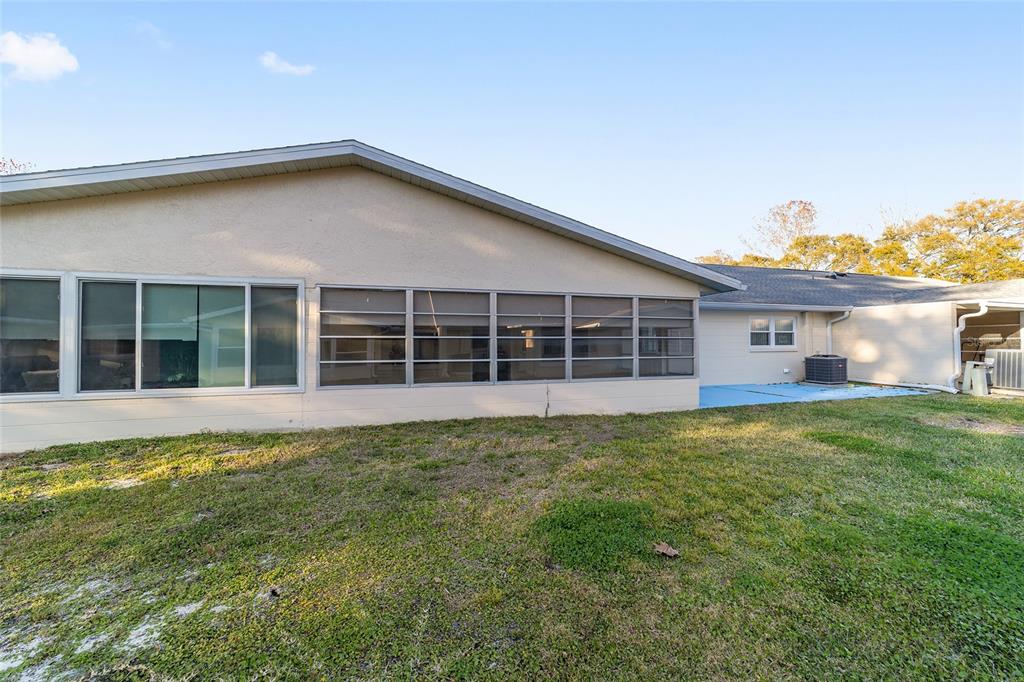 8890 Southwest 96th Street, Unit B Ocala, FL 34481 - Photo 39 of 42 a view of a house with a yard