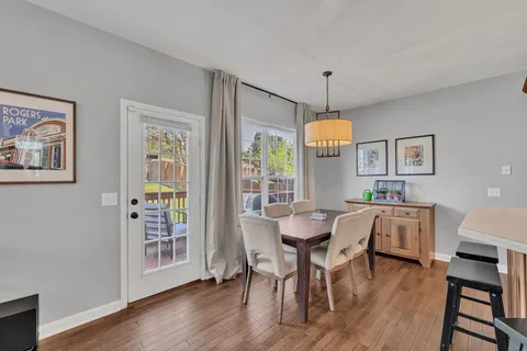 a view of a dining room with furniture window and wooden floor